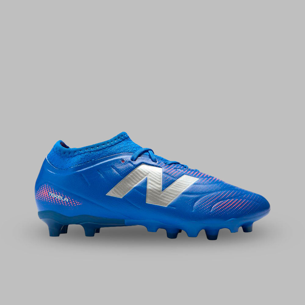 Guayos New Balance Niño Tekela Team Low Laced JNR FG V5 -Azul